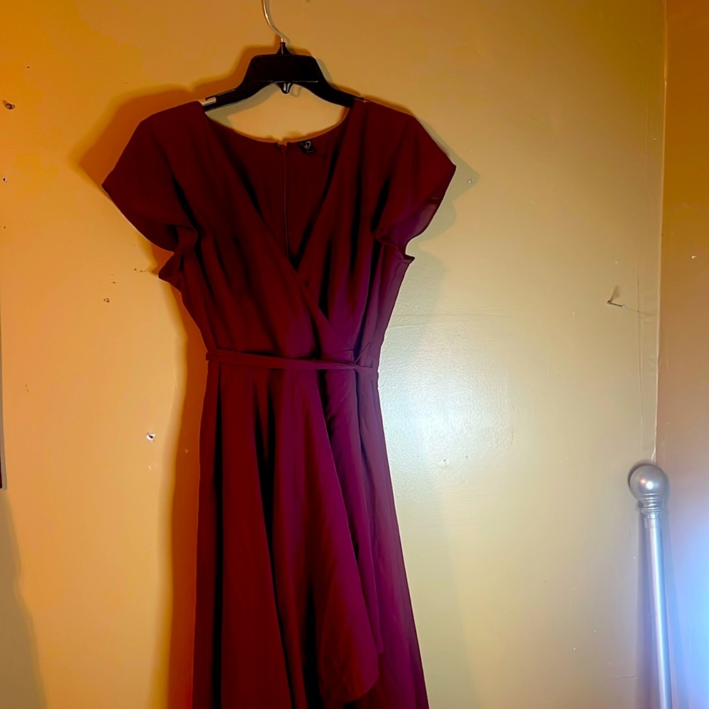 Burgundy ,short sleeve , short in the front and long in the back  dress .